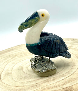 stone pelican on pyrite base