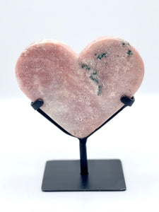 Pink Amethyst heart on black metal stand. 