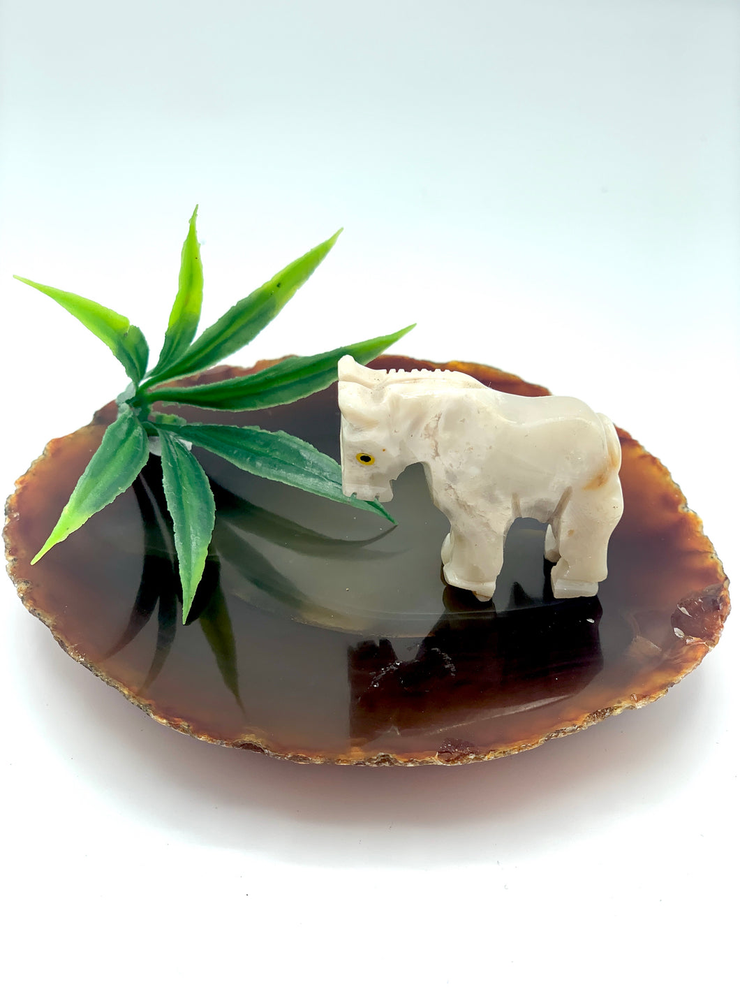 White dolomite horse on agate slice