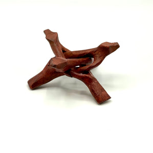 Brown wooden tripod sphere stand