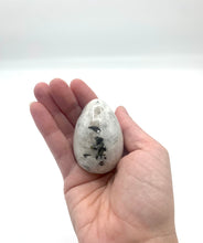 Load image into Gallery viewer, holding a rainbow moonstone egg 
