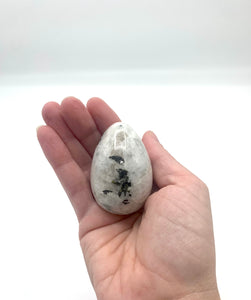holding a rainbow moonstone egg 