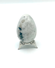 Load image into Gallery viewer, Rainbow Moonstone egg on silver stand
