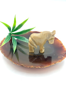 Brown small dolomite horse on agate.