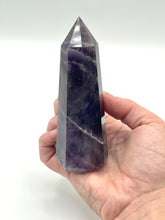 Load image into Gallery viewer, Hand holding amethyst generator 
