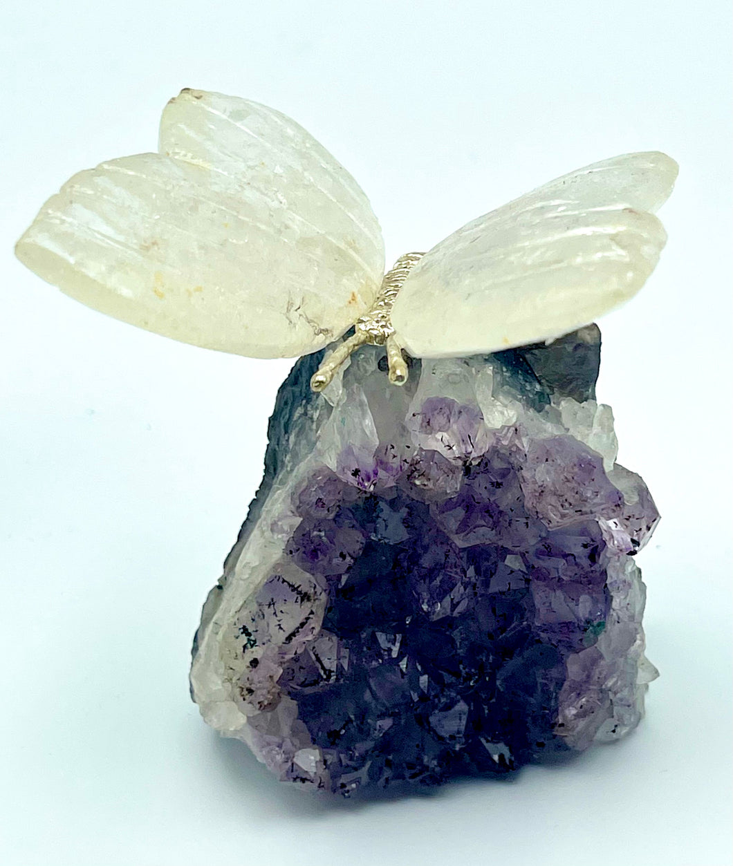 Clear Quartz butterfly on amethyst cluster.