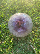 Load image into Gallery viewer, open amethyst geode on grass
