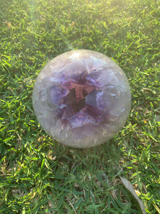 open amethyst geode on grass